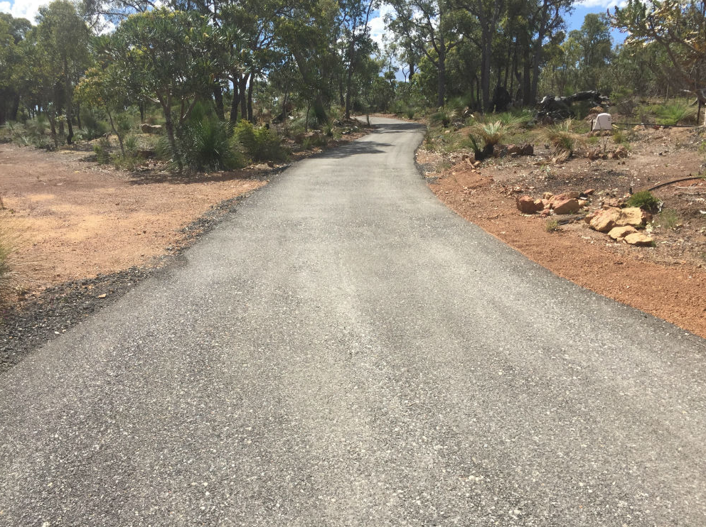 This is a photo of a hot spray & seal bitumen driveway which is in the process of being installed by Lara Road Tech