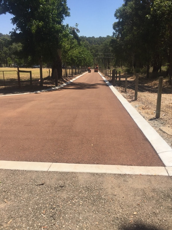 This is a photo of a hot spray & seal bitumen roadway which is in the process of being installed by Lara Road Tech